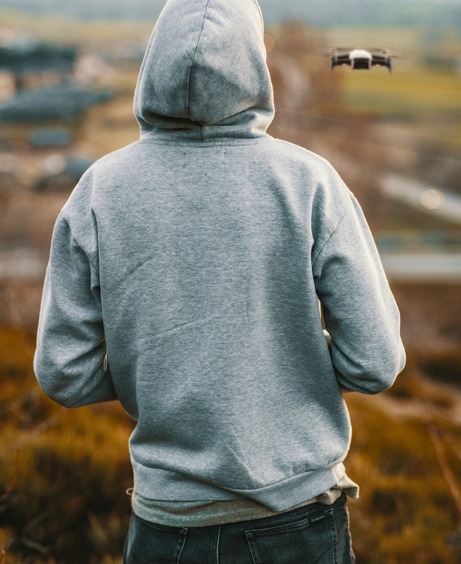 Model wearing the bone HUNT/11 hoodie